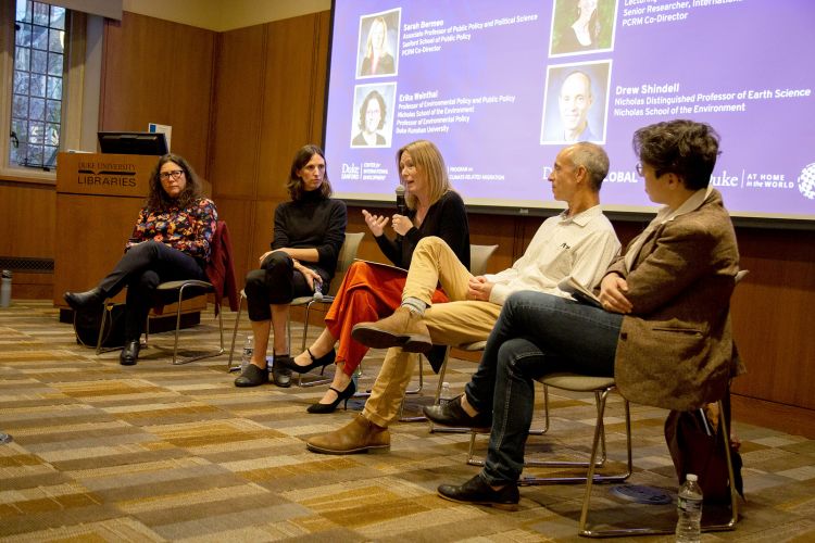 Sarah Bermeo, middle, speaks at the panel on climate-related migration