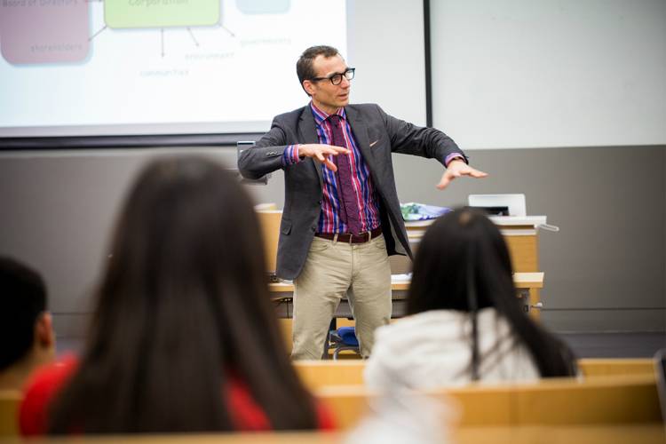 Duke faculty member Wayne Norman teaches in a Duke Kunshan classroom.