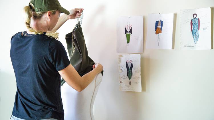 Erin Mathias with her fashion sketches. Photo by Pilar Timpane