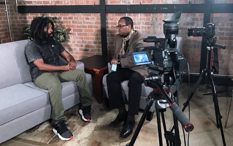 Mark Anthony Neal, right, interviews rapper MURS on 