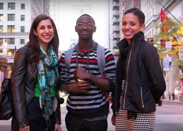 Lauren Fine J.D.'11 smiling with a client of the Youth Resentencing & Reentry Project and the non-profit's co-founder.