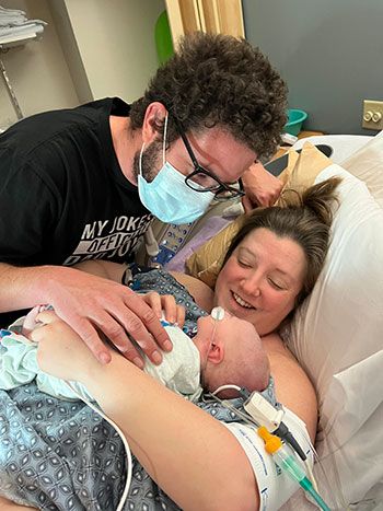 Owen Monroe with parents, just after he was born.