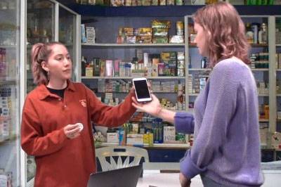 In one of the videos, students demonstrate how to request translation services at a pharmacy. From left: Melissa Gerdts and Madison Alvarado.