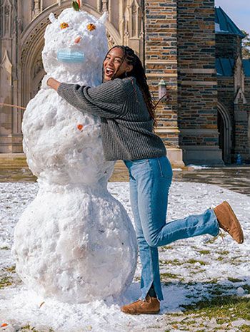 DKU student enjoys playing in. Durham snow