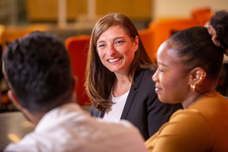 Sunshine Hillygus talks with graduate students working with her on election research.