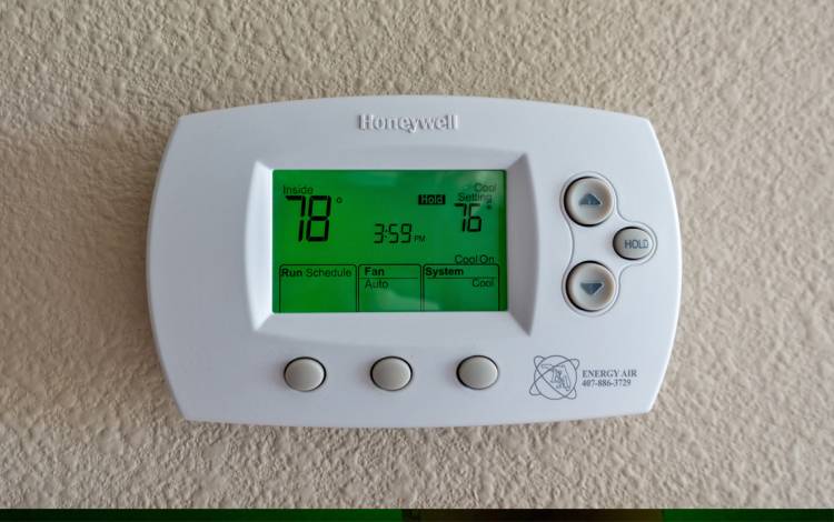 A wall-mounted thermostat.