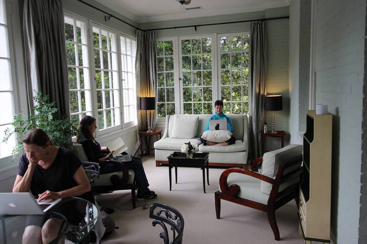 Shaded by an old Magnolia tree, the King's Daughters Inn's sunroom was a favorite place for faculty to work on their writing. Photo by Rebekkah Huss