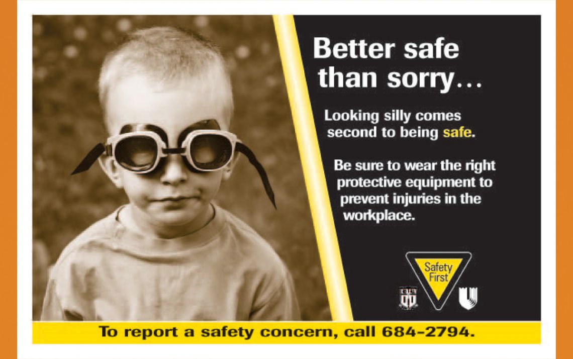 A 2006 safety sign created by the Office of Communication Services shows off the importance of wearing personal protective equipment. Working@Duke file photo.