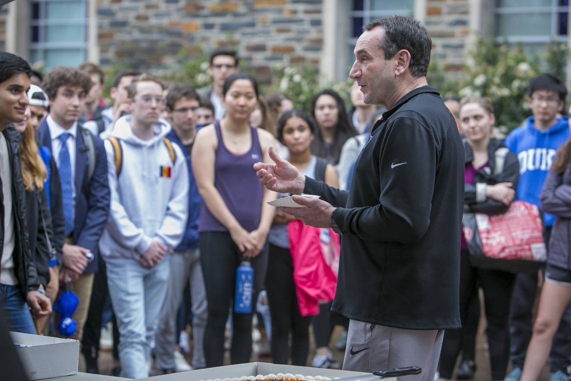 Coach Mike Krzyzewski shares birthday cake and a talk with students who are tenting in front of Cameron Indoor Stadium. After his inspirational talk, the students sang