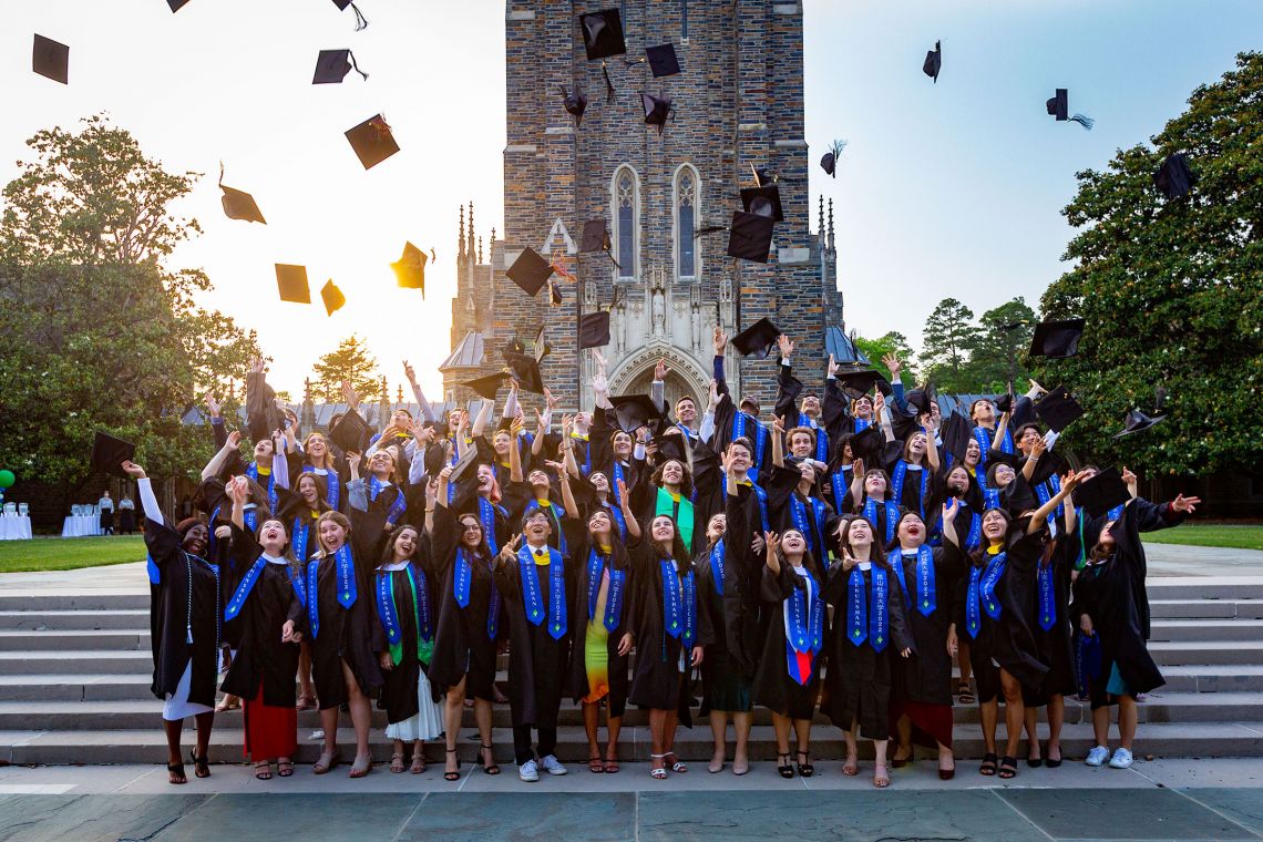 The DKU students graduating in Durham celebrate together after the commencement ceremony.