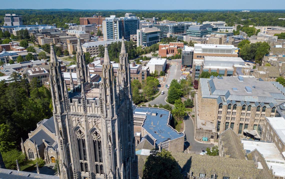 Drone footage captures Duke University Chapel with the Duke University Health System campus in the background. Photo by Bill Snead, Duke University Communications.
