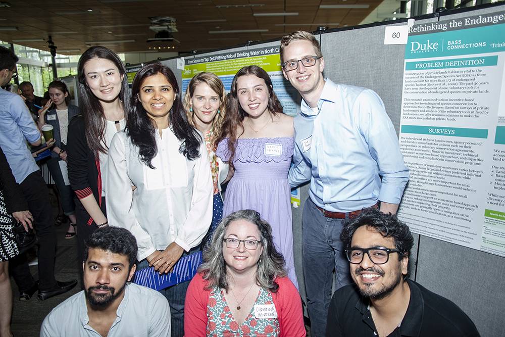 Kathleen Burns, center, top row, and other members of the DECIPHER Bass Connections team at a recent showcase