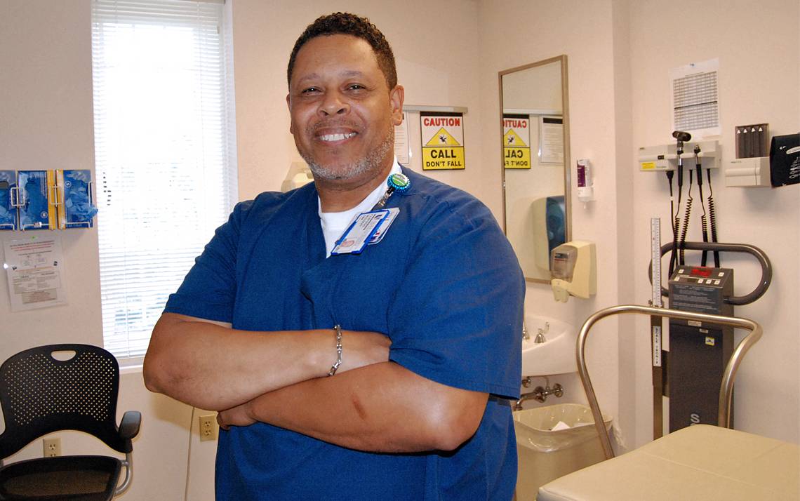 Registered Medical Assistant Clifton Wilson prides himself on looking after patients at the Duke Rheumatology Clinic. Photo by Stephen Schramm.