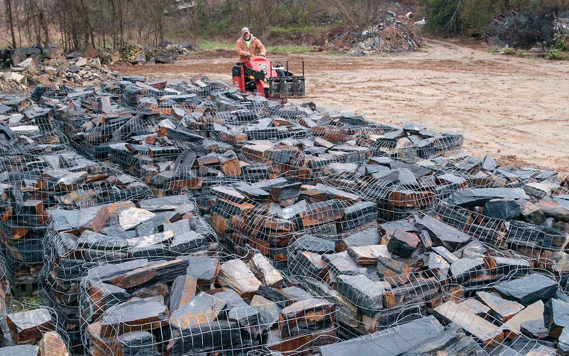 Chunks of Duke stone sits on pallets at Cleve Wagstaff shop near Roxboro, waiting to be moved to Duke University's campus.