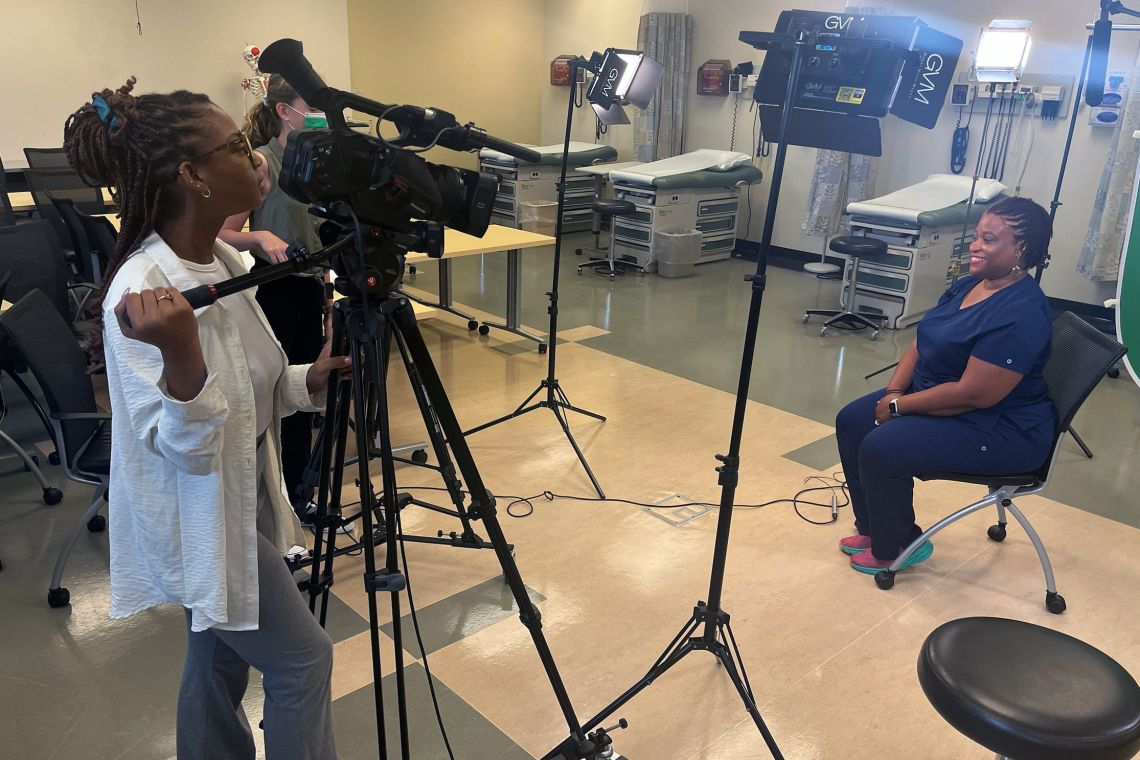 Evona Dancey (left) helped tape a campaign video for the School of Nursing.