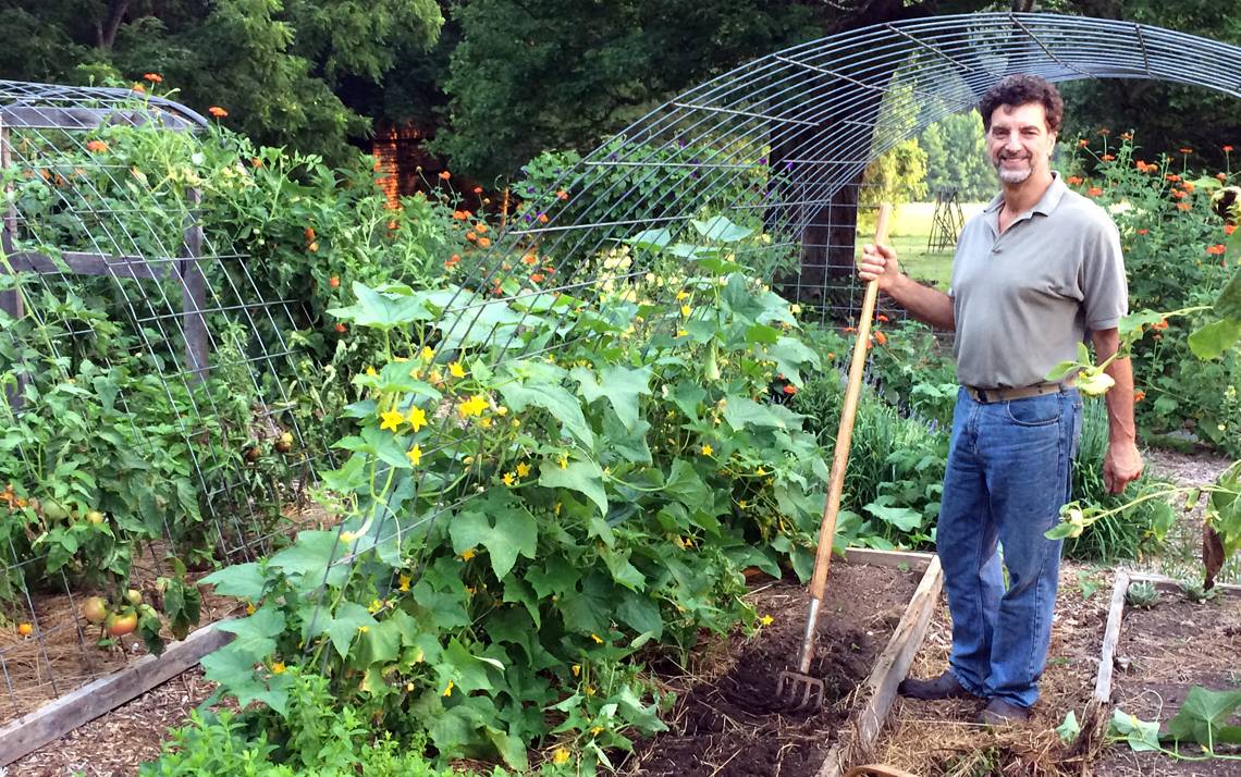 Myron Taschuk works in his home vegetable garden in Orange County.