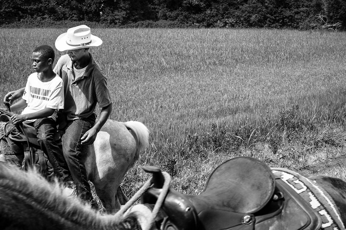 Father and Son (Cecilia, La.) Photograph by Jeremiah Ariaz