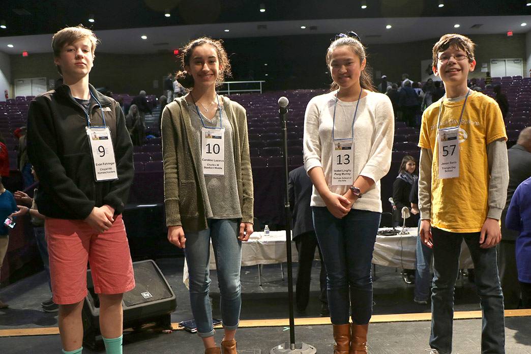 The four spelling bee finalists, left to right: Evan Fahringer, Caroline Lazarus, Isabel LingYu Peng Murray and Jason Sorin. Photo by April Dudash