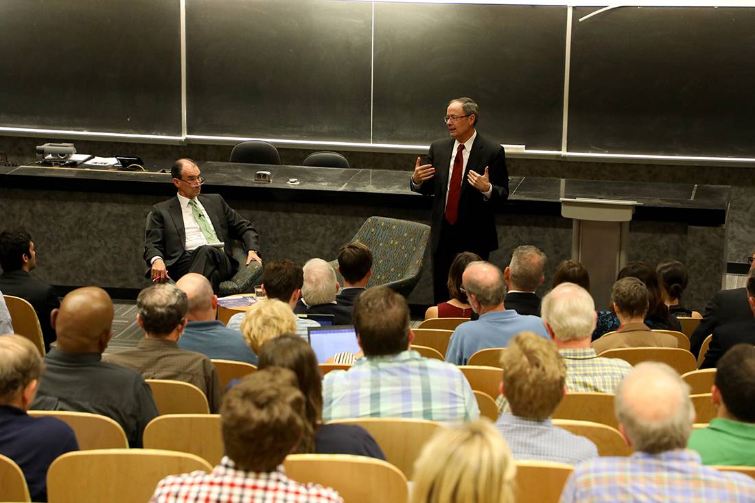 Gen. Keith Alexander speaks before a large audience in Gross Hall. Duke professor and former ambassador Patrick Duddy looks on. Photo by Catherine Angst