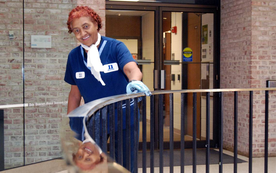 For Gloria Biddings, the circular brass handrail in the atrium of the Mary Duke Biddle Music Building is the focal point of the facility, so she takes great care in making it shine. Photo by Stephen Schramm.