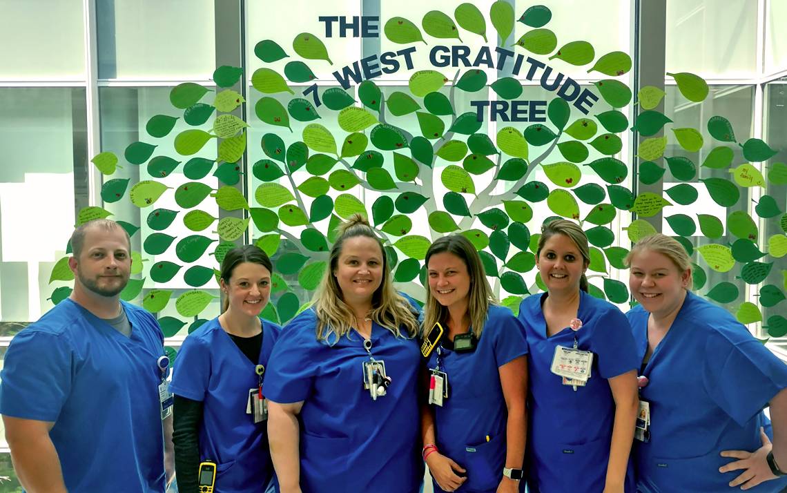 From left to right: Nurses Jason Stokes, Kelsey Collier, Jessica Seabrooks, Ashley Anderholm, Catherine Shuford and Heather Pena, stand in front of the 