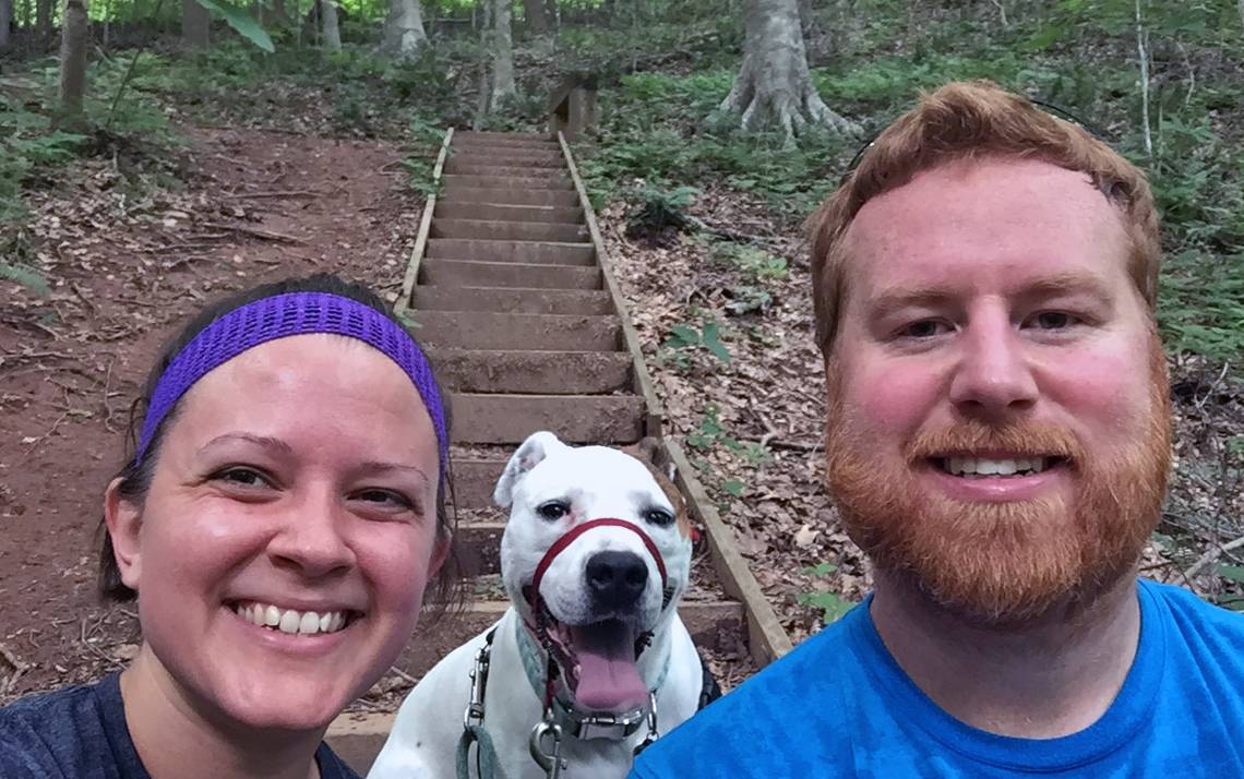 Tricia Smar, left, and Brent Darden enjoy a hike with their dog, Bella, at Swift Creek Bluffs.