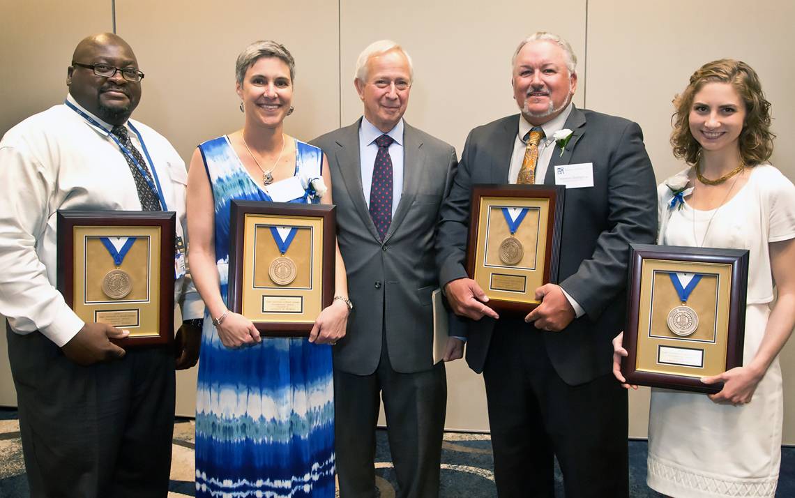 President Richard H. Brodhead, center, with Presidential Award winners. Not pictured: Amanda Kelso, Executive Director and Assistant Vice Provost, Global Education Office for Undergraduates. Photos by Chris Hildreth, Duke University Photograpghy.