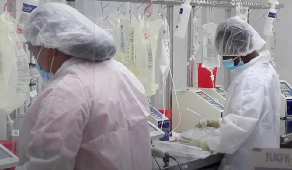 nurses giving patient an infusion