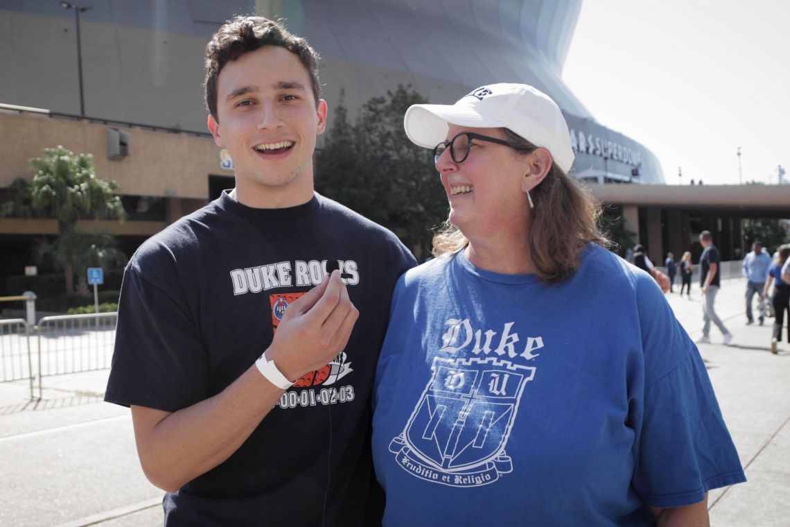 Legacy Grad Jimmy Rodríguez and his mother, Stacy Jordan Rodríguez, stand outside the Superdome in New Orleans