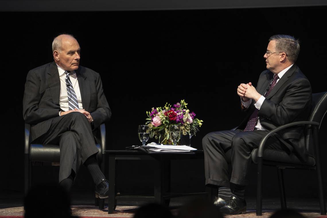 Former White House Chief of Staff John Kelly, left, speaks with Duke's Peter Feaver. Photo by Shaun King.