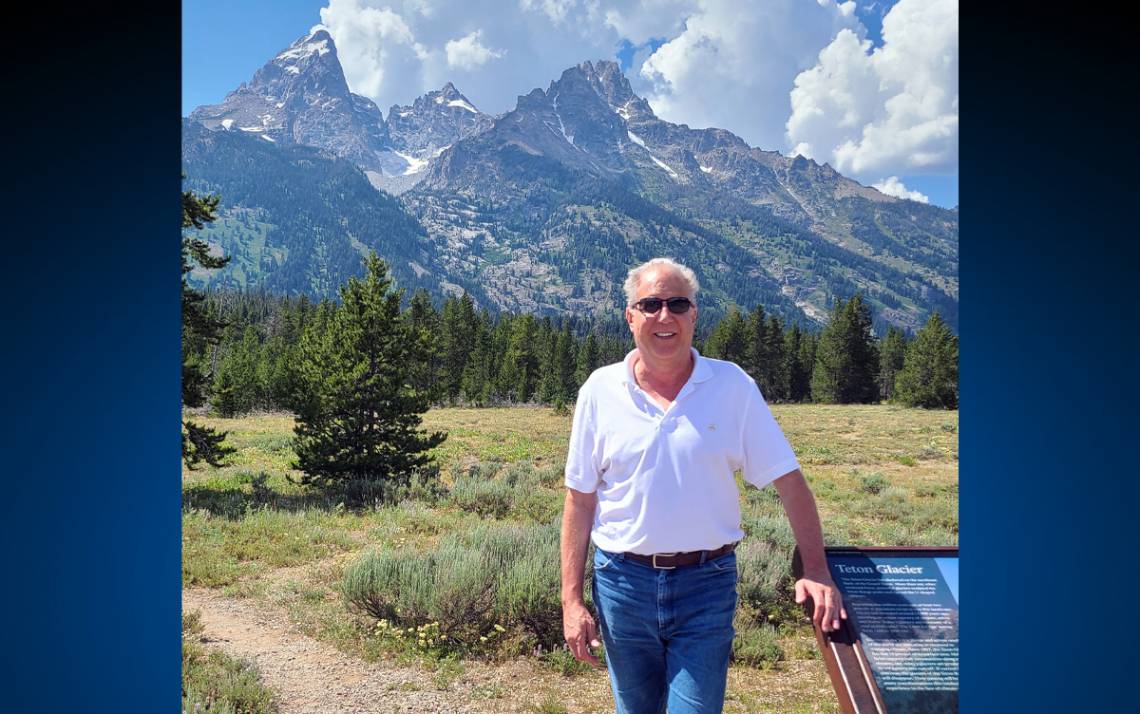 Keith Laemont in front of mountains.