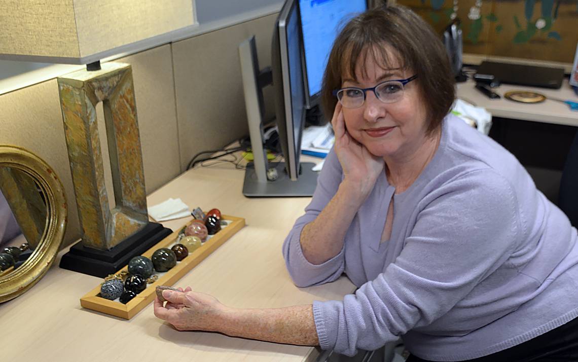 Lisa K. Dilts keeps a collection of gemstones on her desk.