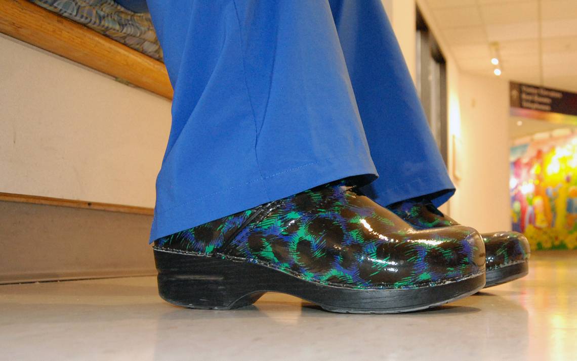 Maddie Morales, a nurse at Duke University Hospital, brings comfort and color to her day with choice of footwear. Photo by Stephen Schramm.