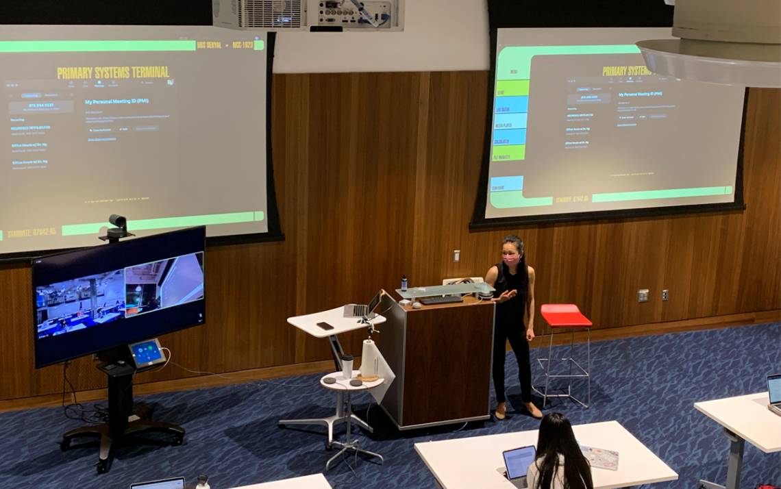 Minna Ng, assistant professor of the practice of Psychology and Neuroscience, teaches a class alongside a Zoom Cart. Photo by Yimin Wei.