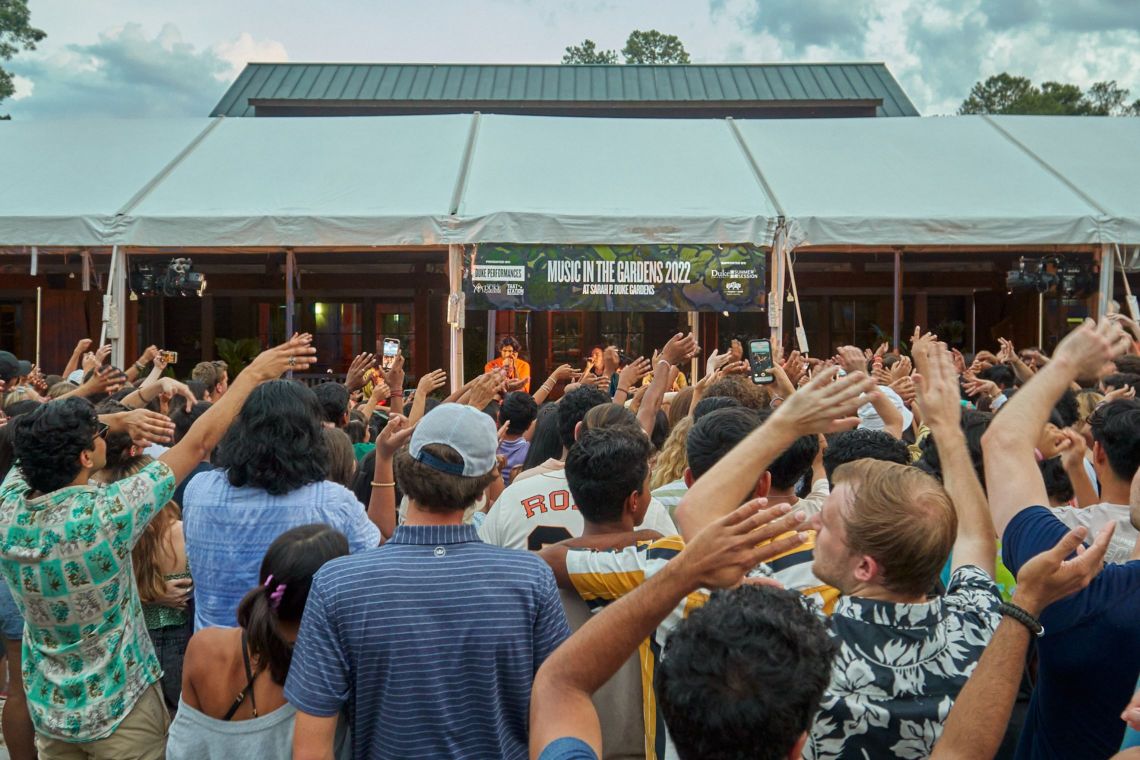 Fans wave their hands as Weston Estate performs at Music in the Gardens