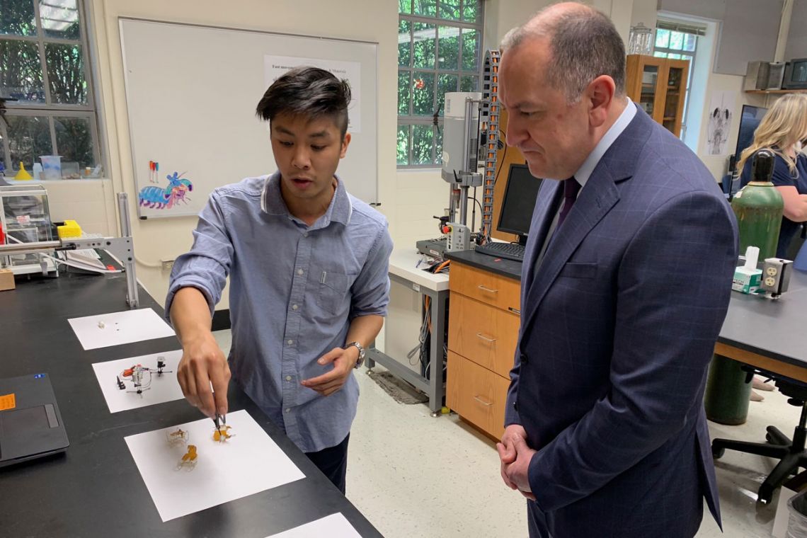 Justin Jorge (left) , a Duke PhD student in biology, speaks with Gabriel Camarillo, under secretary of the Army, about research conducted in the lab led by Professor Sheila Patek. (Photo courtesy Kamil Sztalkoper, US Army)