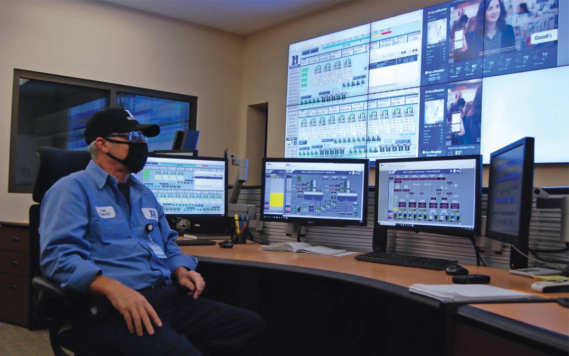 Paul Schuler, control room operator at Chiller Plant No. 2, keeps a close eye on displays showing real-time data from the many pumps, chillers and boilers that make up Duke’s chilled water and steam systems. Photo by Stephen Schramm.