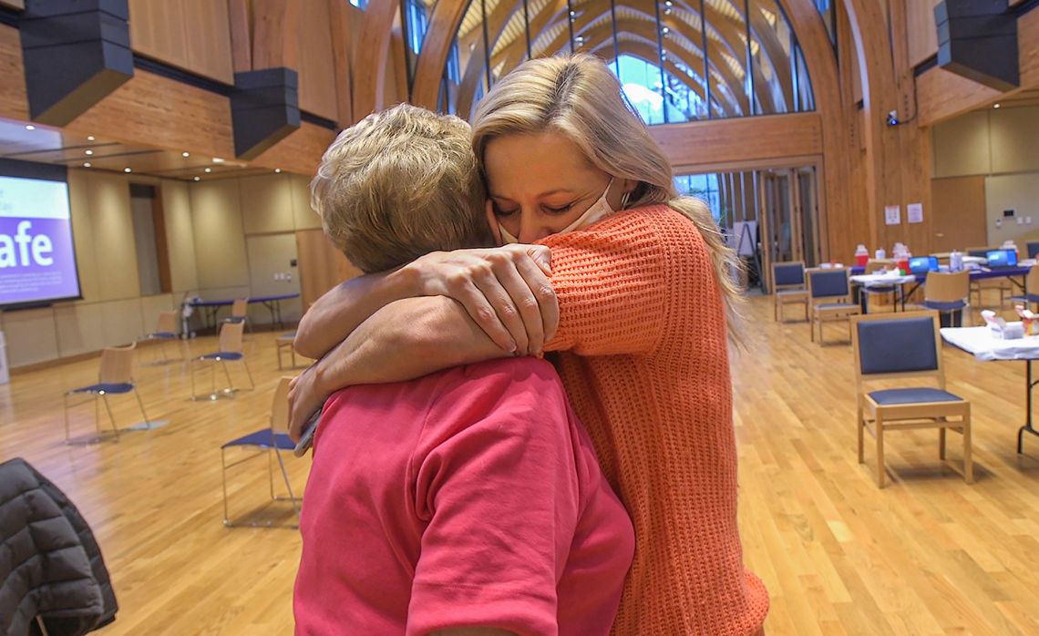 Dina White hugs her mom Barbara Falco, 79, after she received her COVID-19 vaccination on Jan. 6, 2021, at Karsh. Photo by Shawn Rocco.