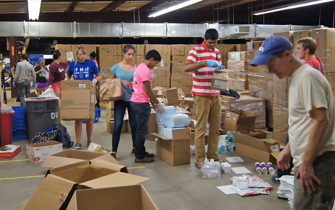 Volunteers sort surplus medical supplies for REMEDY at Duke.