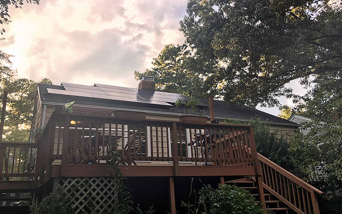 Solar panels atop Tam Huynh's home help keep her energy costs low.