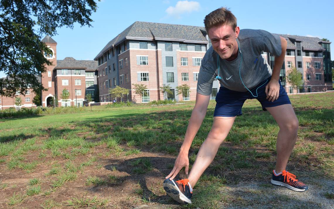 Jonathan Black stretching before the first Duke Run/Walk Club session. Photo by Leanora Minai.