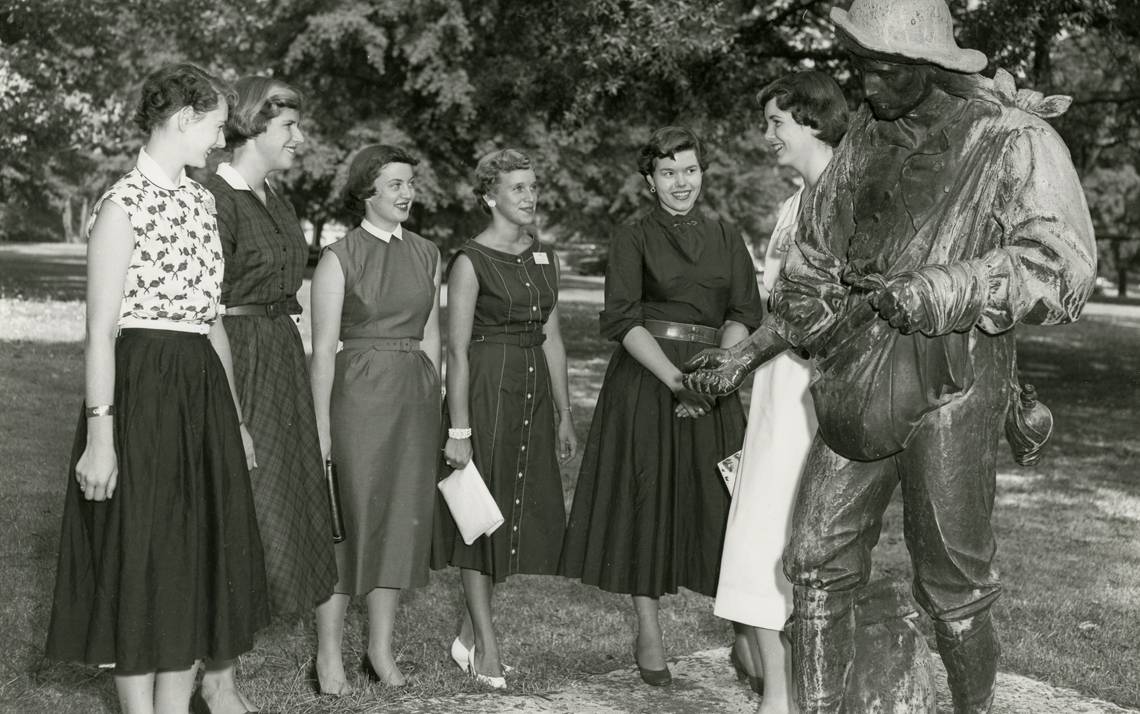 Duke students gather around The Sower on East Campus in 1954.