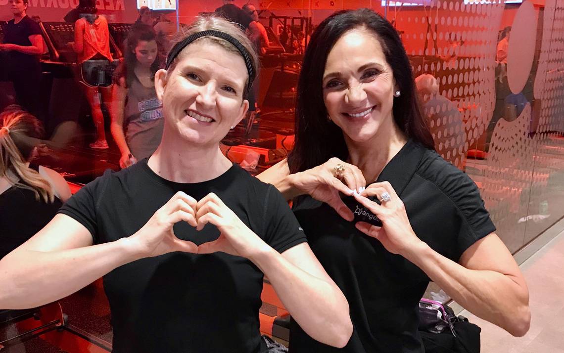 Stacy Sabraw, left, with the founder of Orangetheory Fitness, Ellen Latham, after a Valentine's Day workout class in Durham. Photo courtesy of Stacy Sabraw.