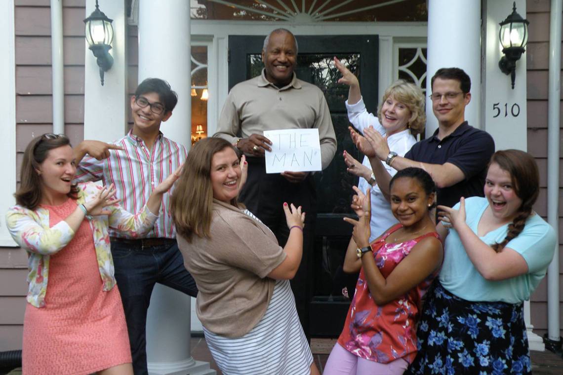 Phail Wynn celebrates with local public school teachers living in the Duke-sponsored Teach House.
