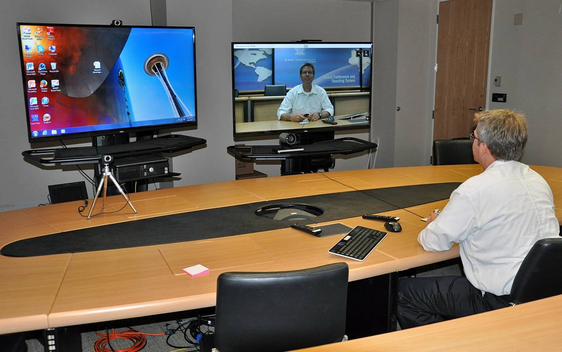 Eric Carter at Fuqua School of Business tests a teleconference session.