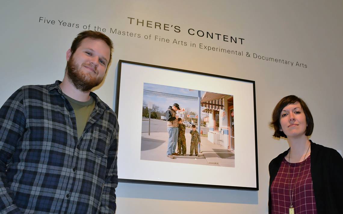 Alex Cunningham and Lisa McCarty stand in the Rubenstein Photography Gallery, which will house the “There’s Content” exhibit until June 20. Cunningham curated the exhibit, which contains 23 photographs and six films celebrating the five-year anniversary
