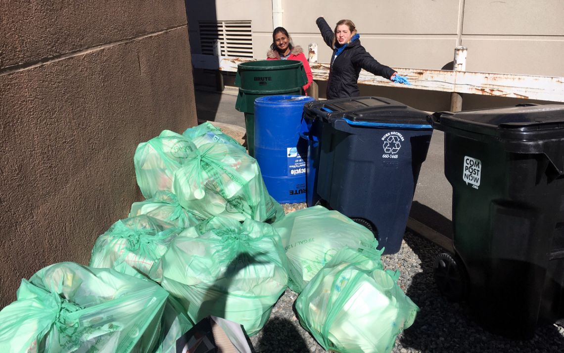 Student volunteers stand with some of the waste diverted from landfill during a K-Ville Zero Waste effort  during the 2019-20 season. Photo courtesy of Pooja Lalwani.