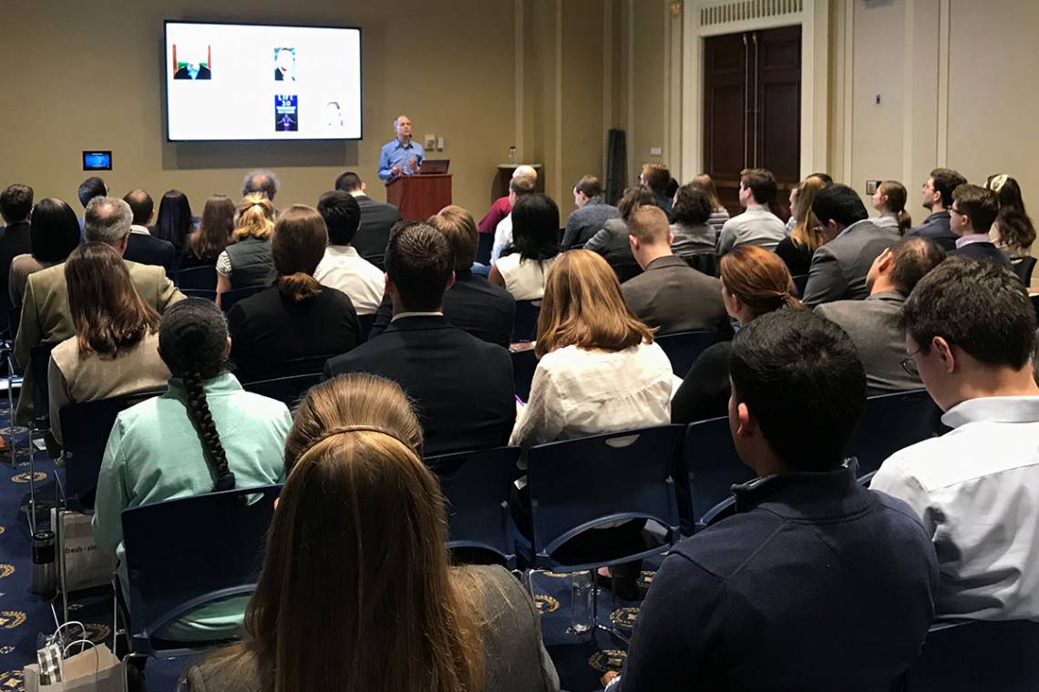 Vincent Conitzer talks with congressional staff on Feb. 15.