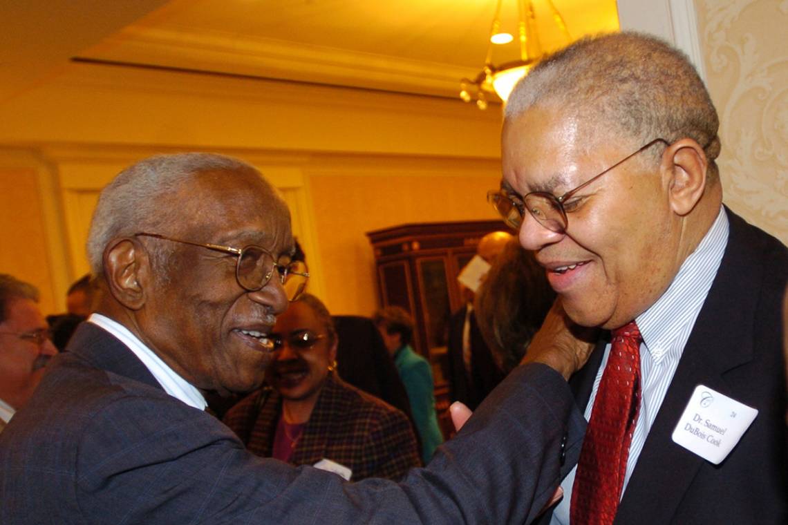 Samuel Dubois Cook and John Hope Franklin at a Cook Society dinner.