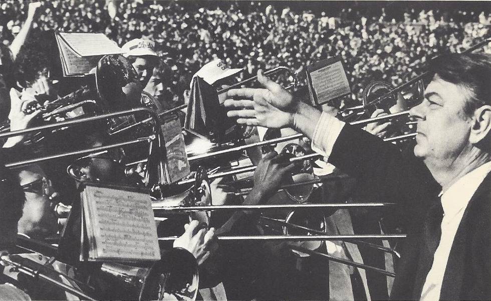 Jim Henry directs the pep band.